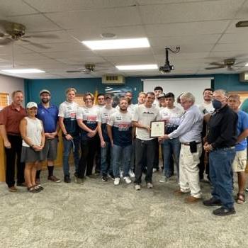 Rugby team with Socorro County officials